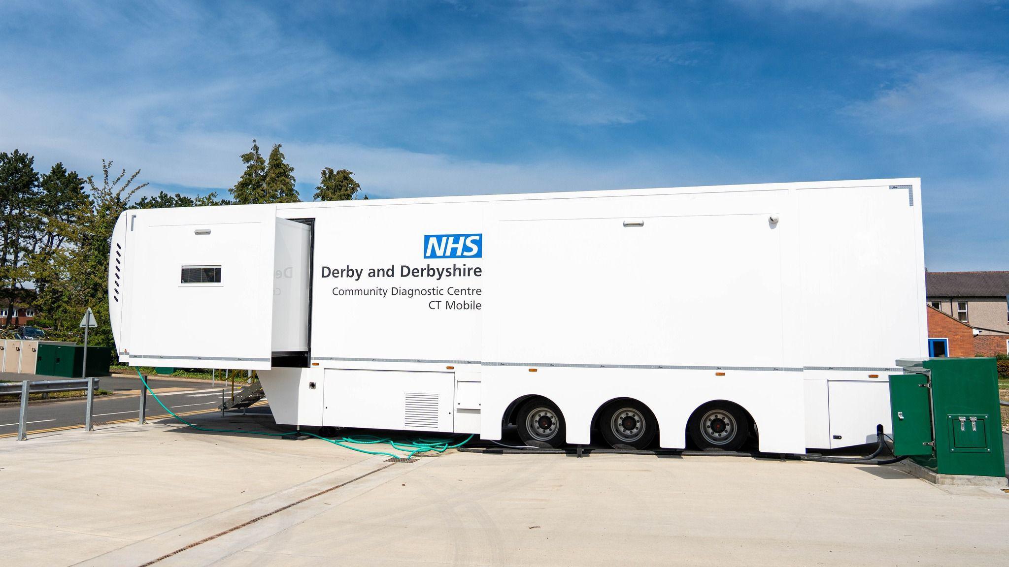 A white lorry which has a CT scanner inside