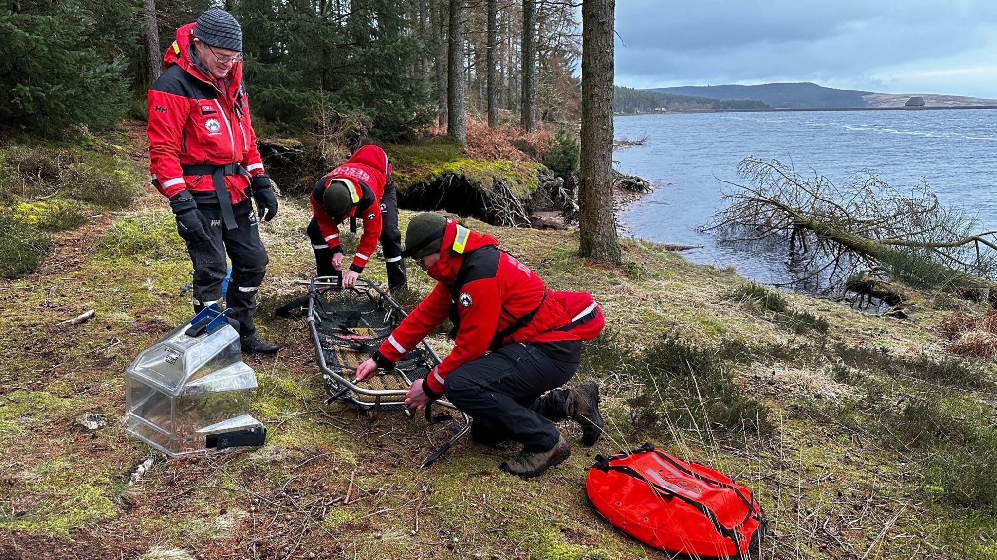 The team setting up a stretcher