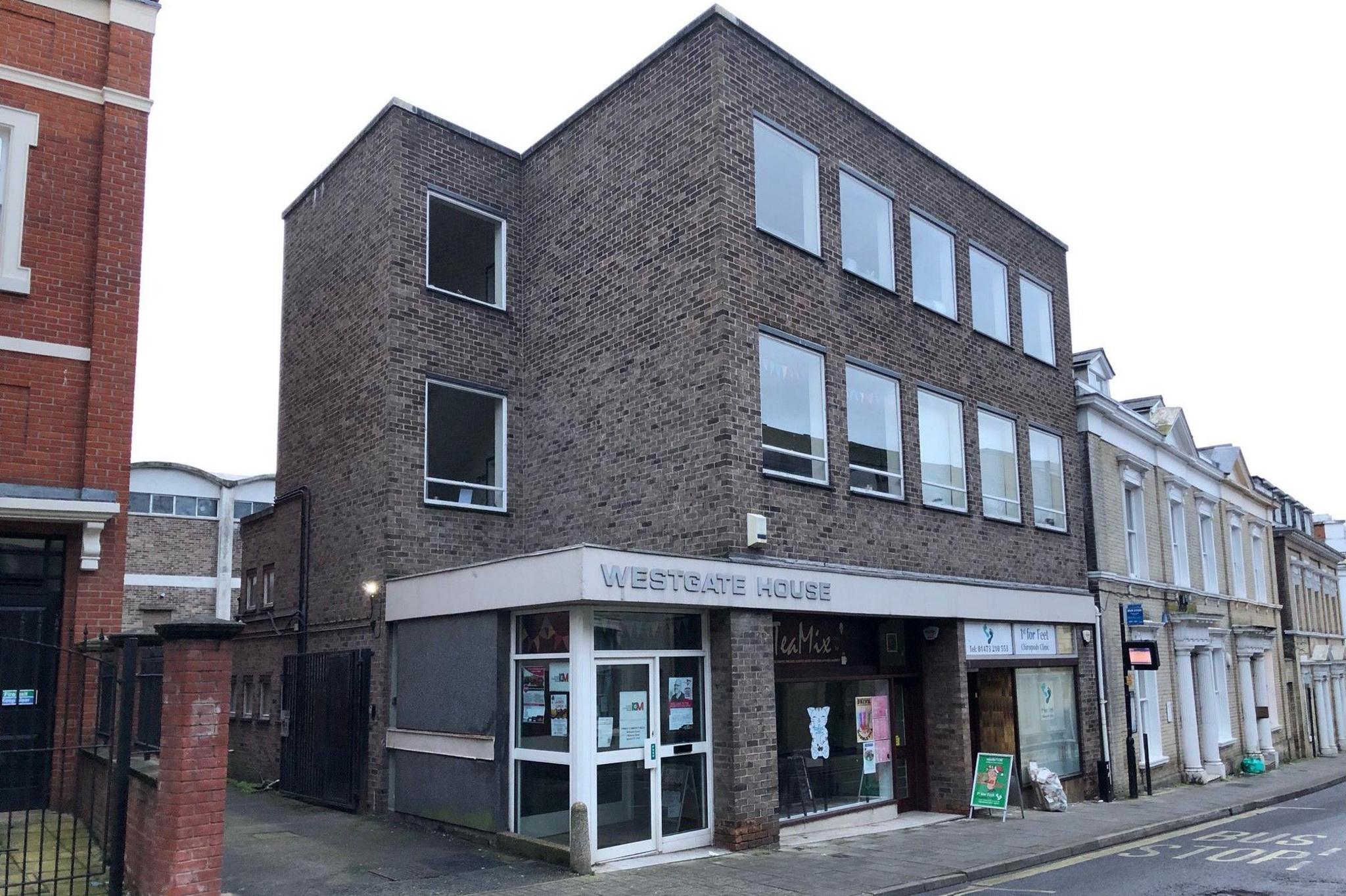 A three-storey brick building, with Westgate House printed on the front.