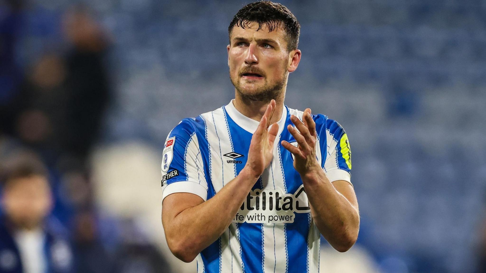 Matty Pearson applauds the Huddersfield Town fans