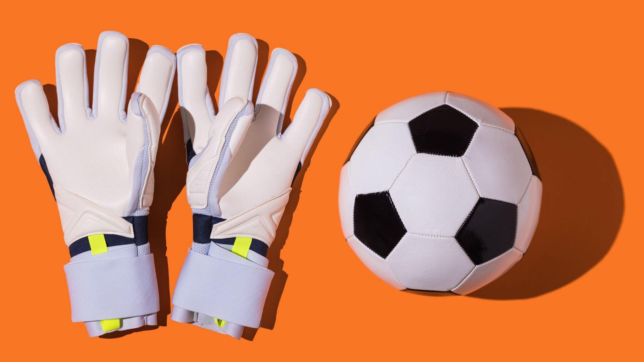 goalie gloves and a football