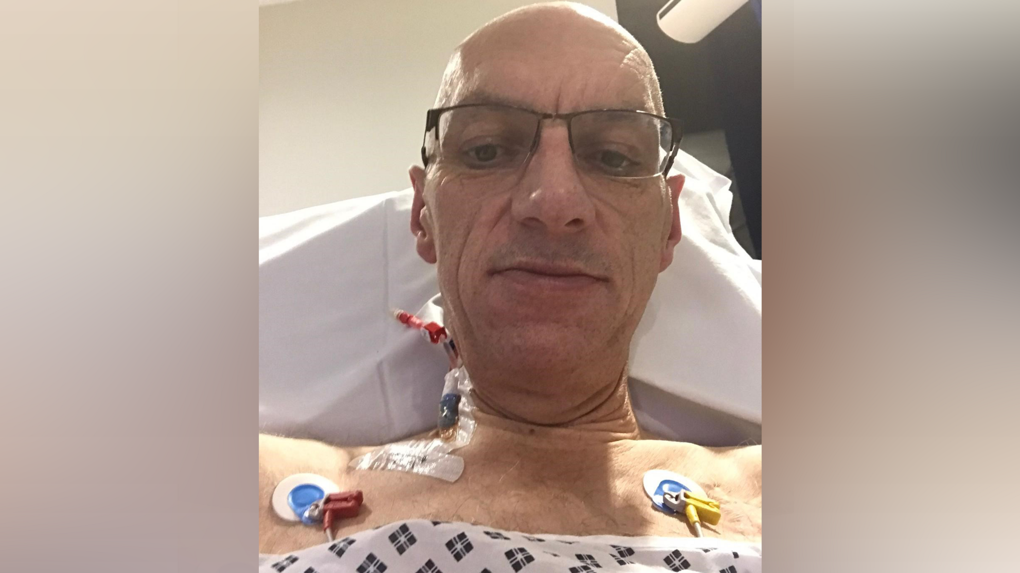 Paul in hospital with pads connected to his chest