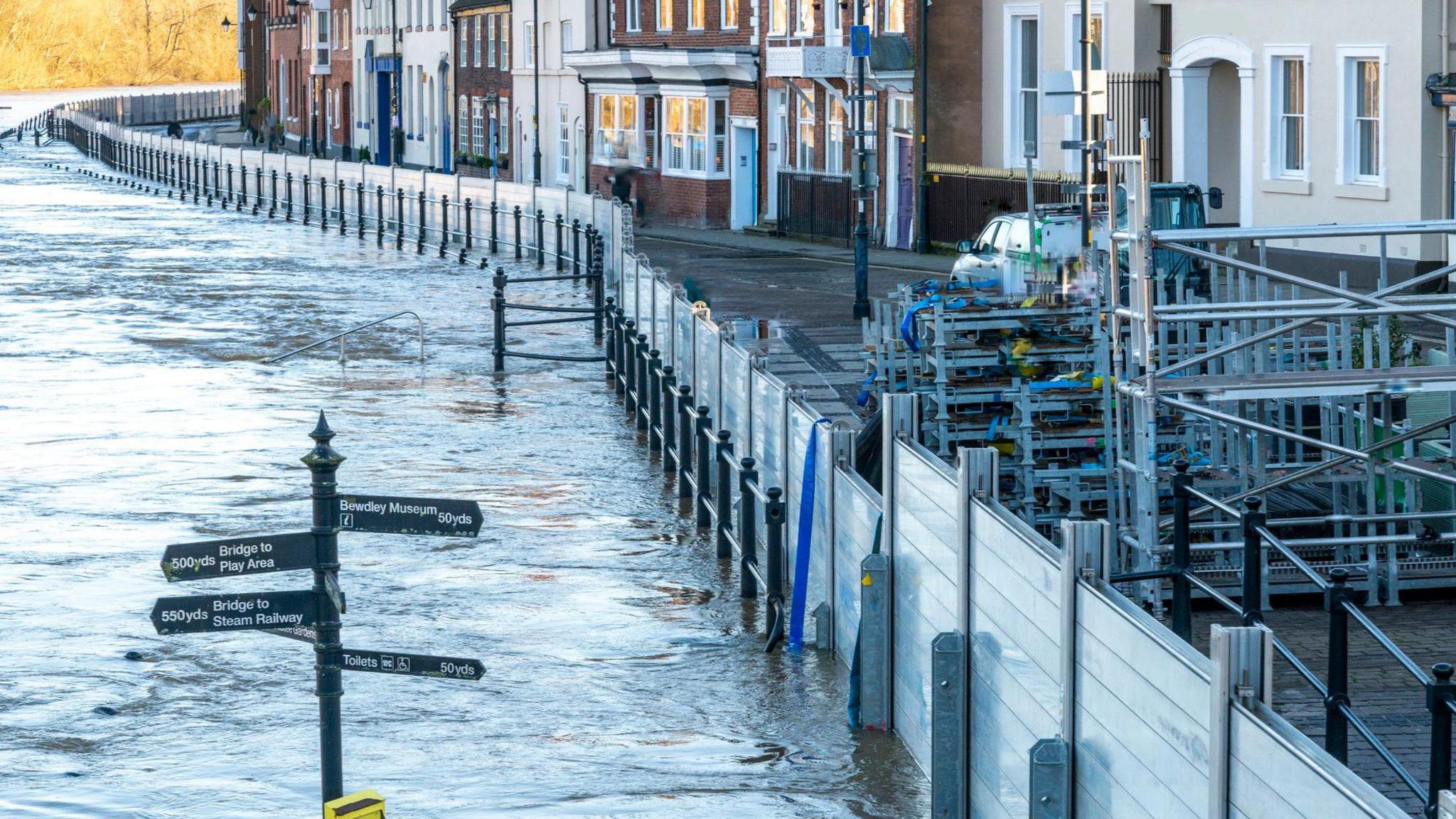 Flood defences holding back water from houses