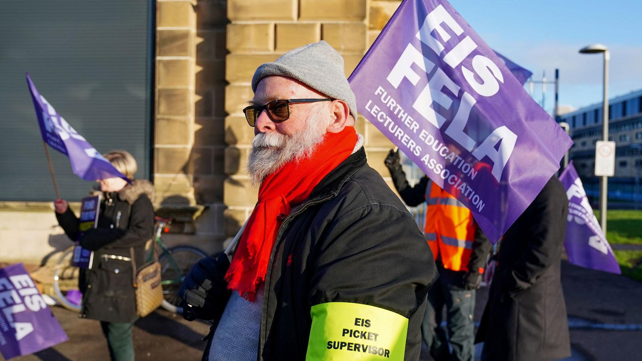 Striking college lecturers