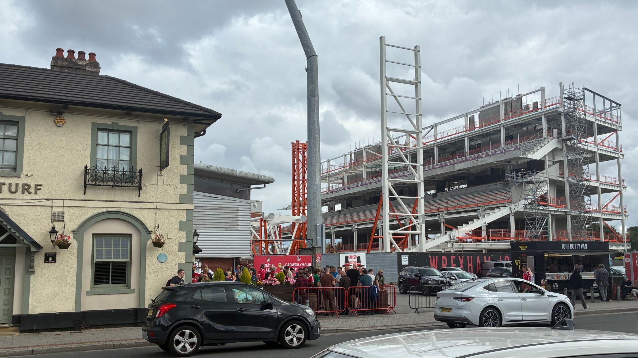 View from the road of the new Kop stand adjacent to the Turf pub