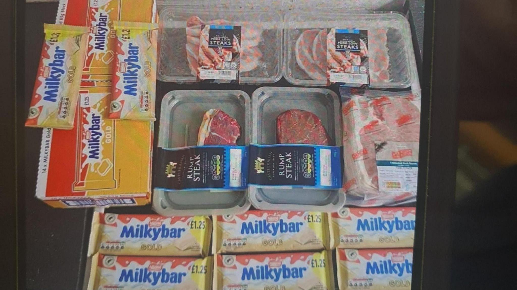 An image of the shoplifted items that were being raffled, including Milkybar and steaks