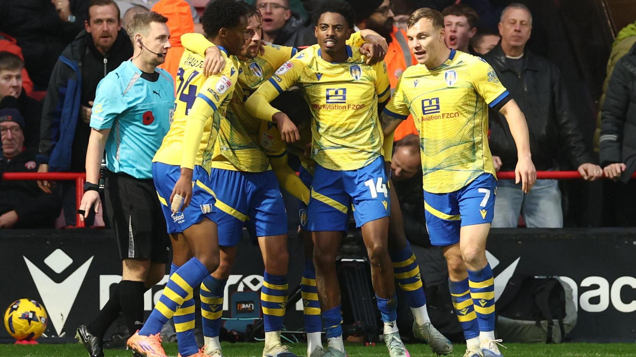 Colchester players celebrate Kyreece Lisbie's goal