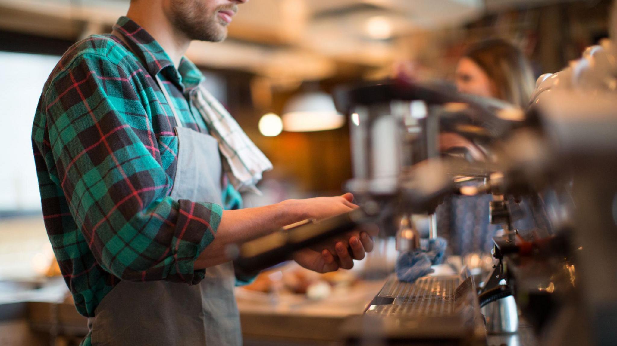 man working in a coffee shop