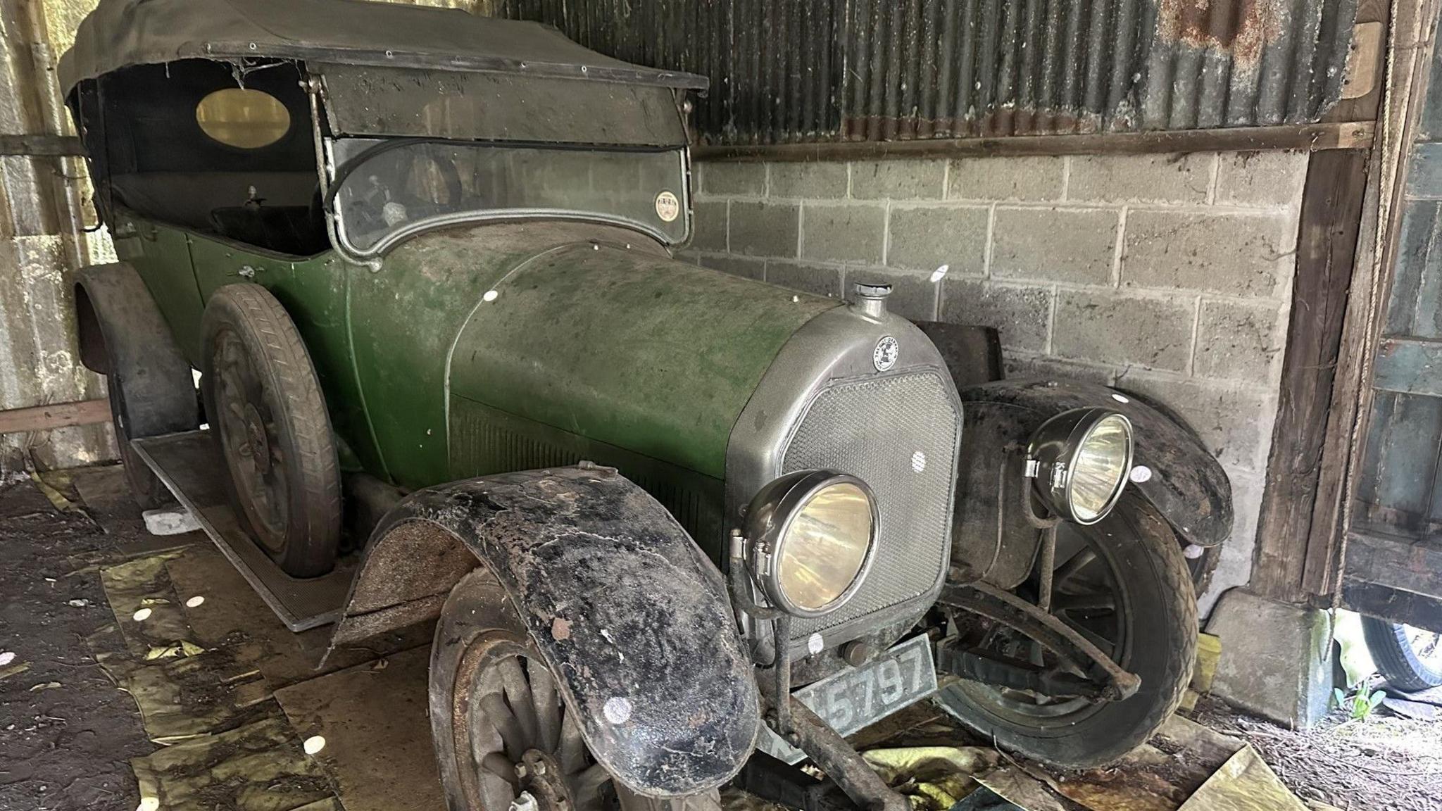 Green 1921 Talbot Darracq covered in dust 