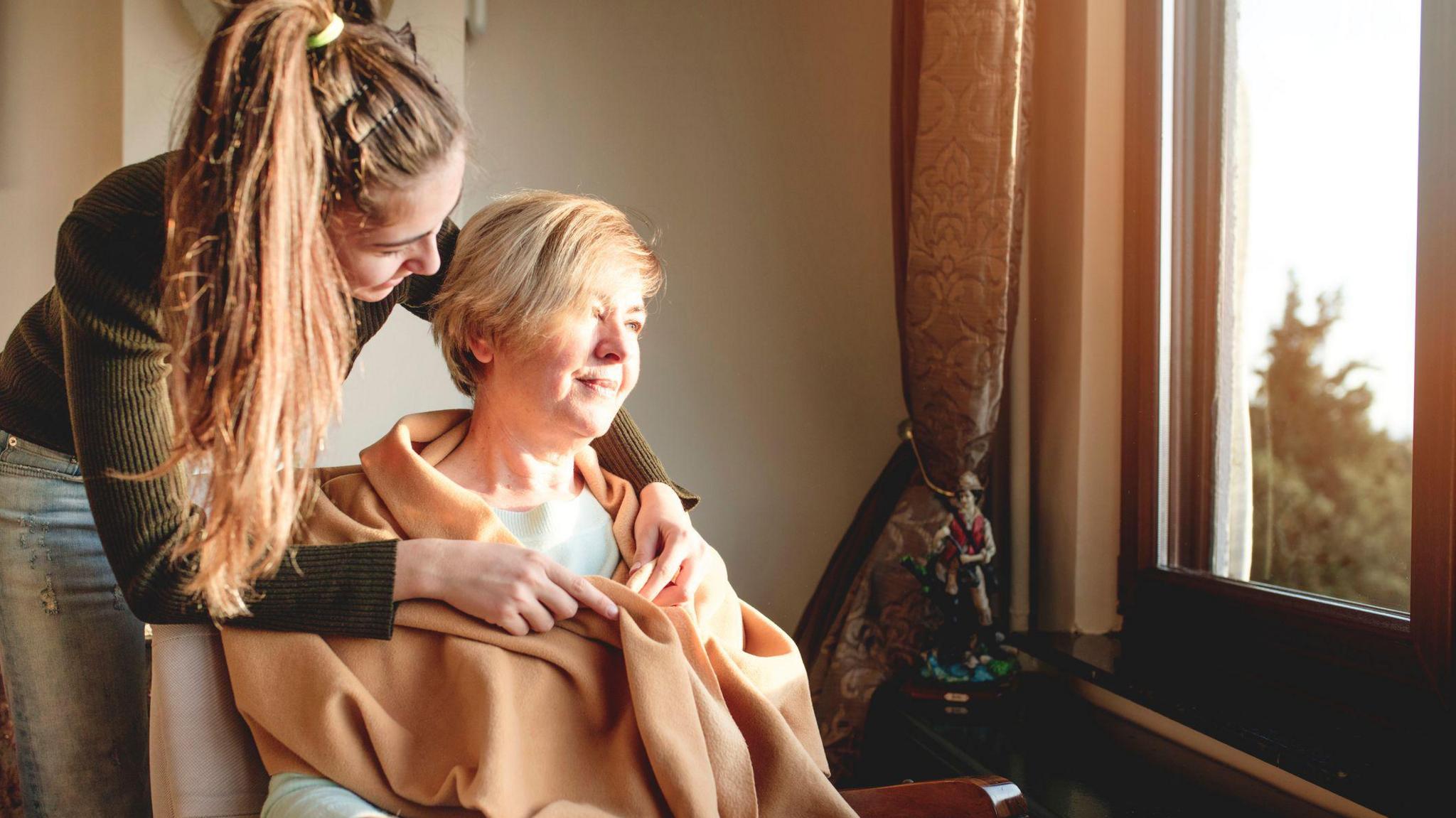 Young carer attending to an adult