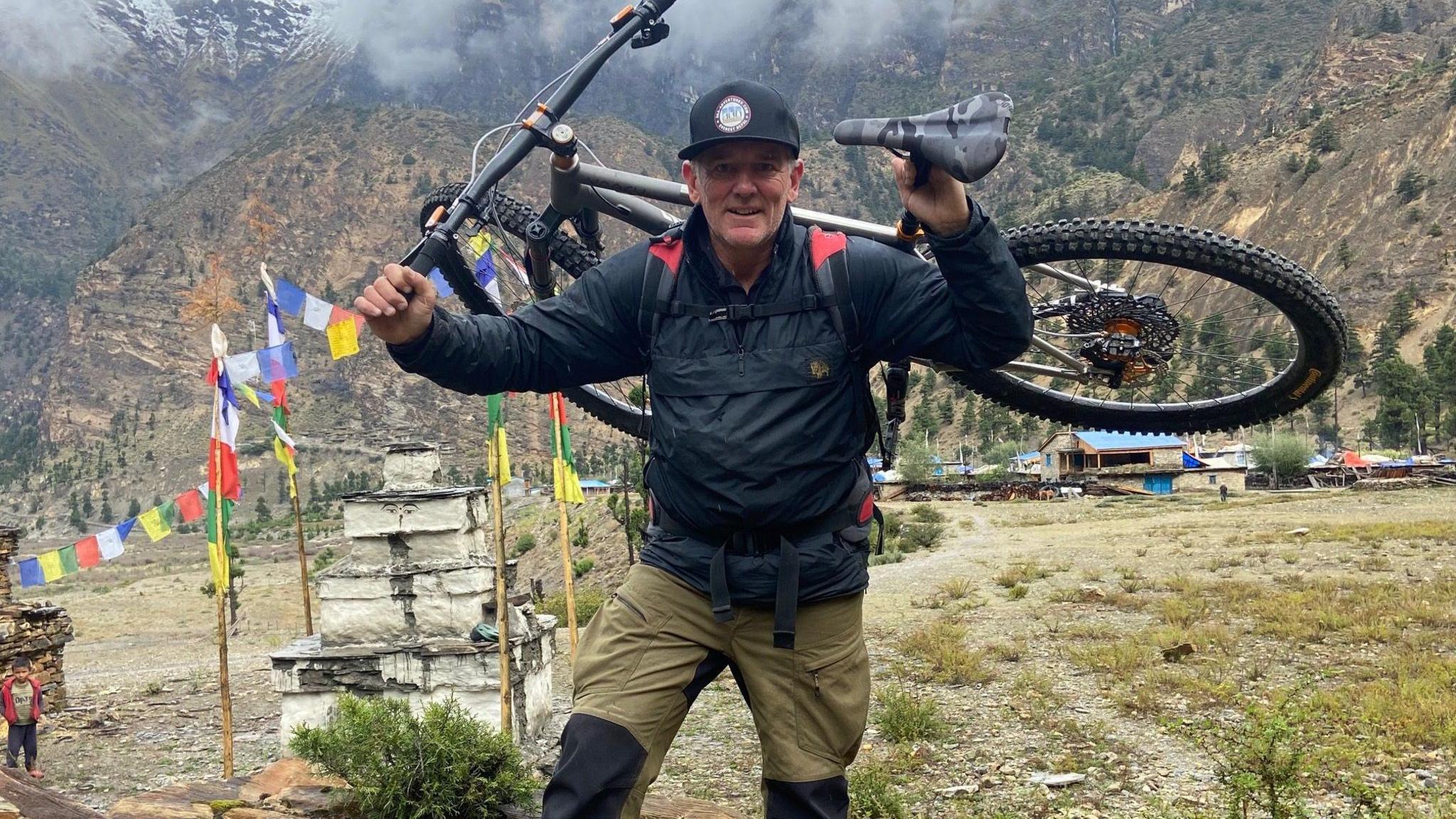 Neil Laughton with his bike in the Himalayas