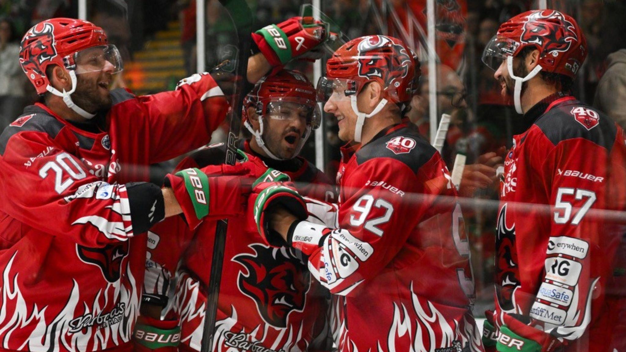 Cardiff Devils in red jerseys celebrate a goal