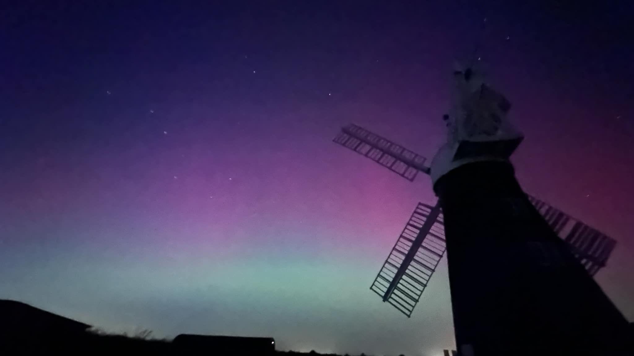 Pinkish skies pictured behind the silhouette of North Leverton windmill in Nottinghamshire