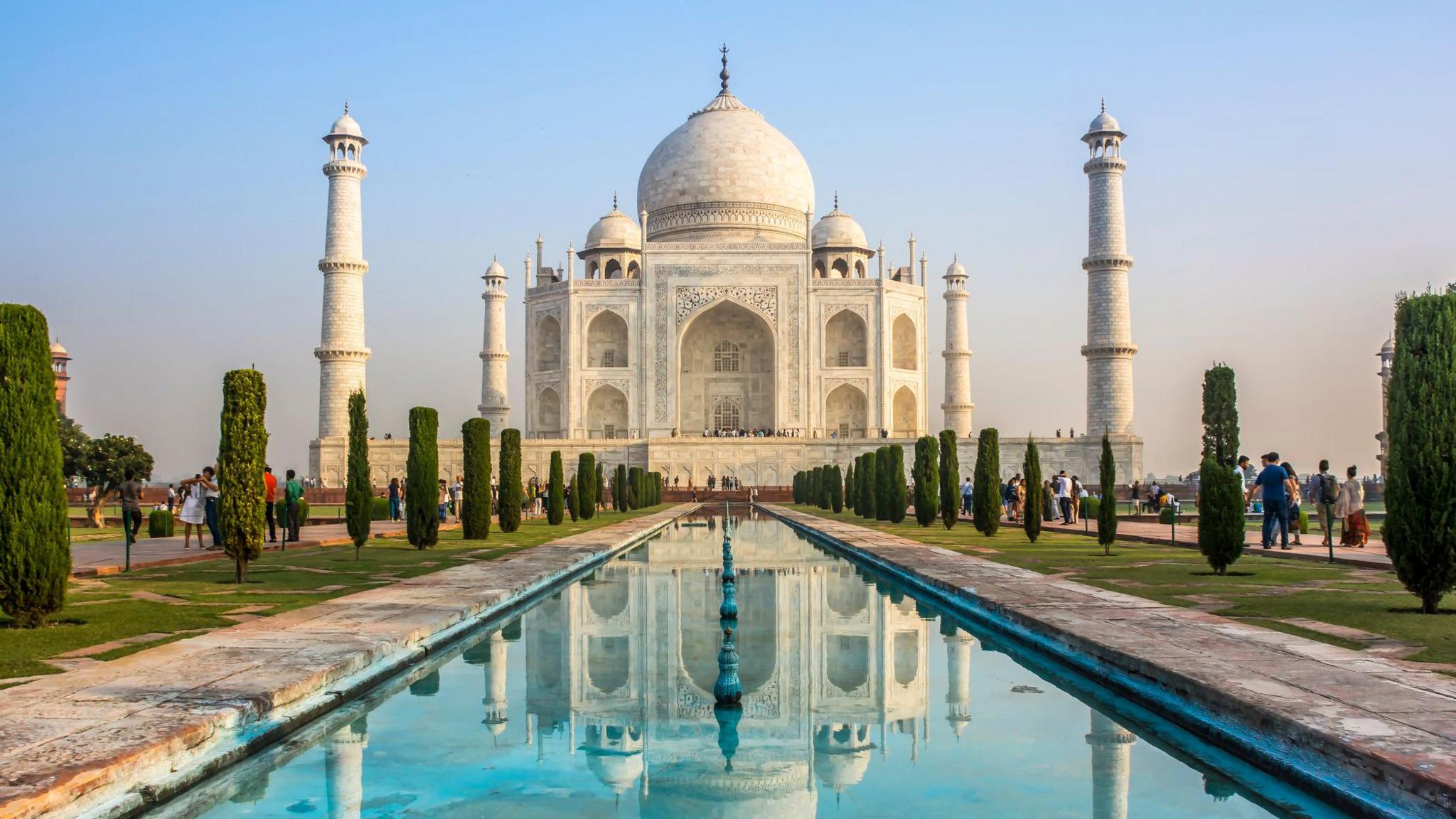 The Taj Mahal in India, a giant white marble building reflected in water