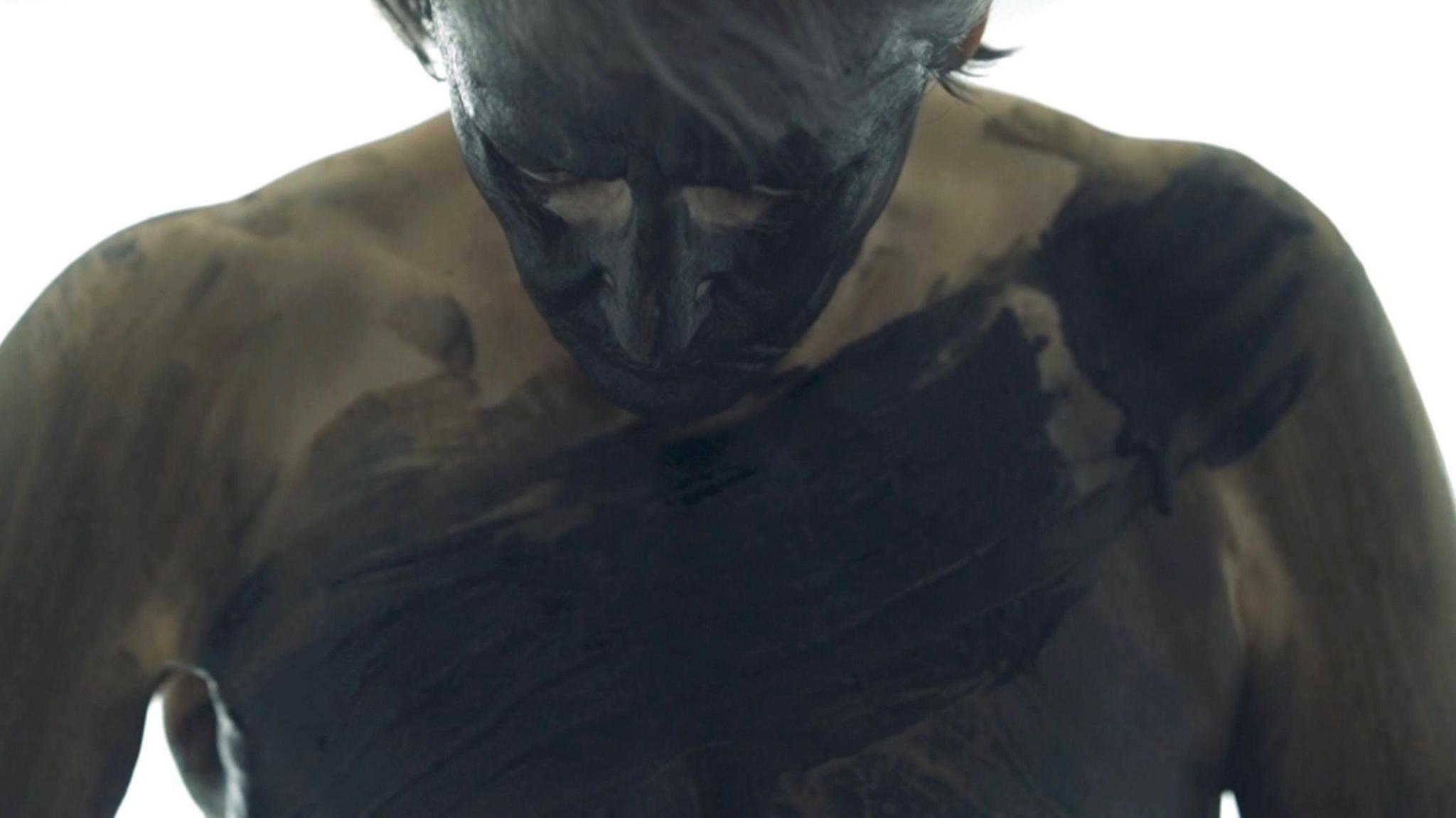 Helen plastered in mud and coal.