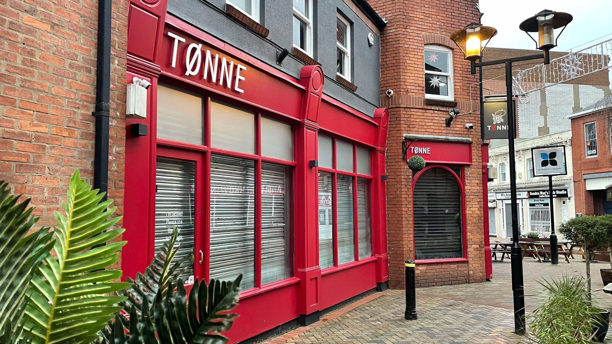 The front of Tonne bar with distinctive red frontage