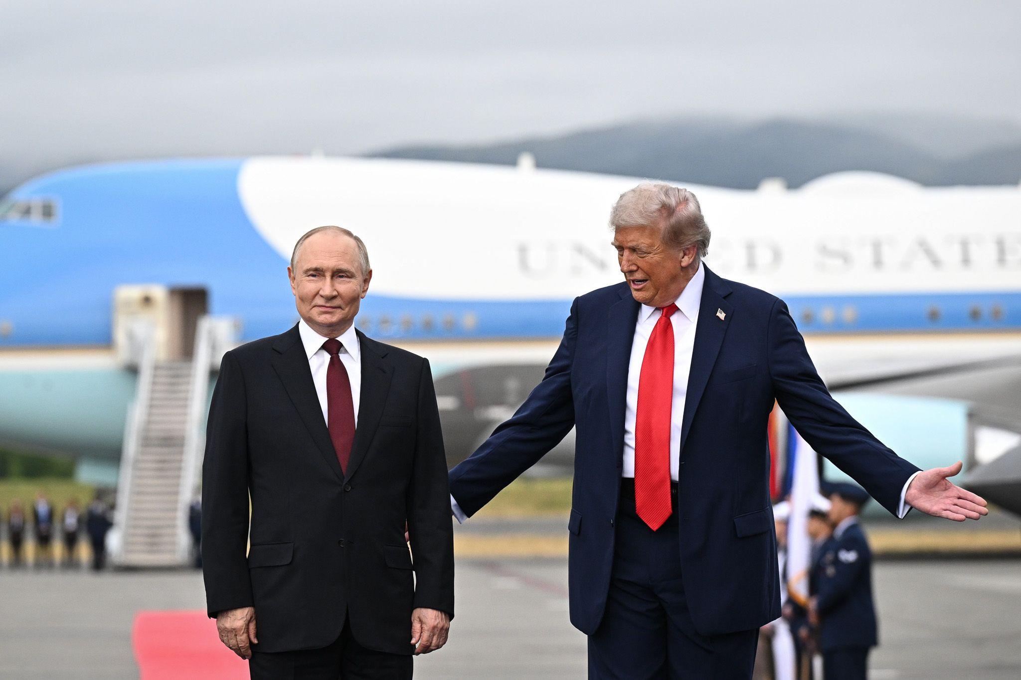 Donald Trump welcomes Vladimir Putin to Alaska with a red carpet and a warm handshake.