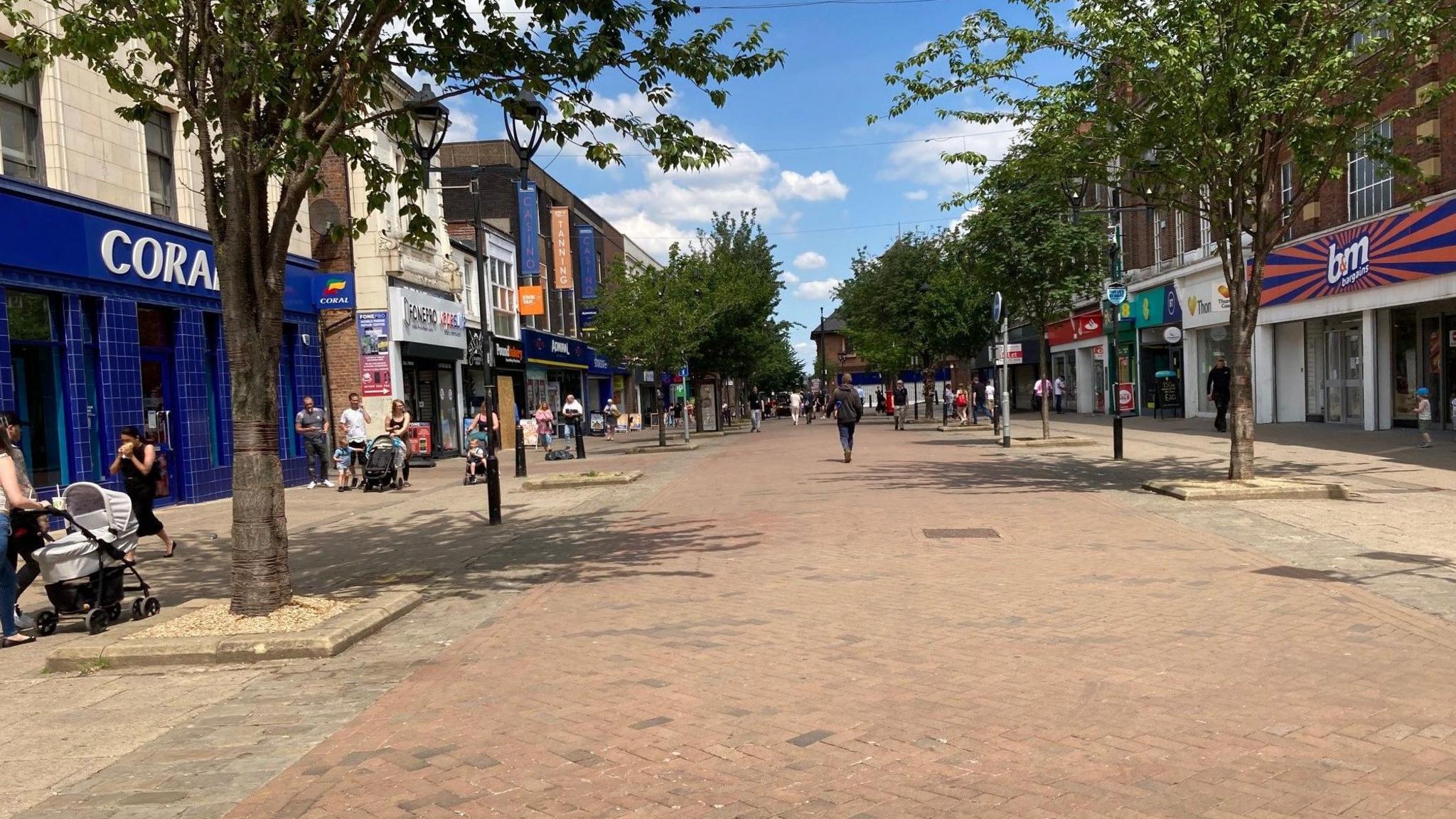 Rotherham town centre, street with shoppers walking along pedestrianised area