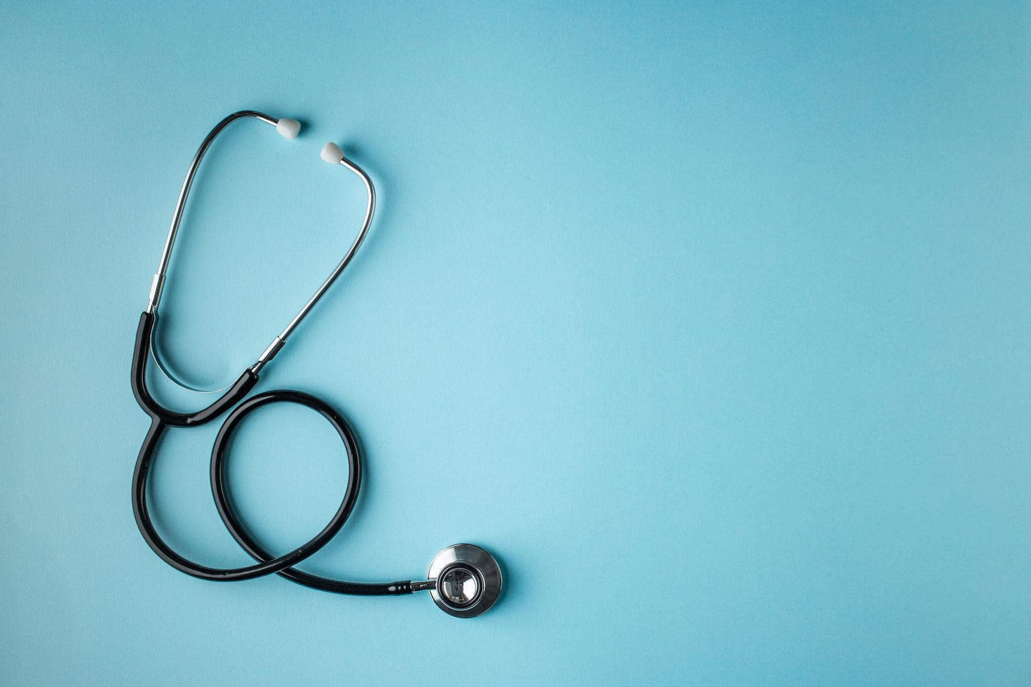 a photograph of a stethoscope on a plain background.