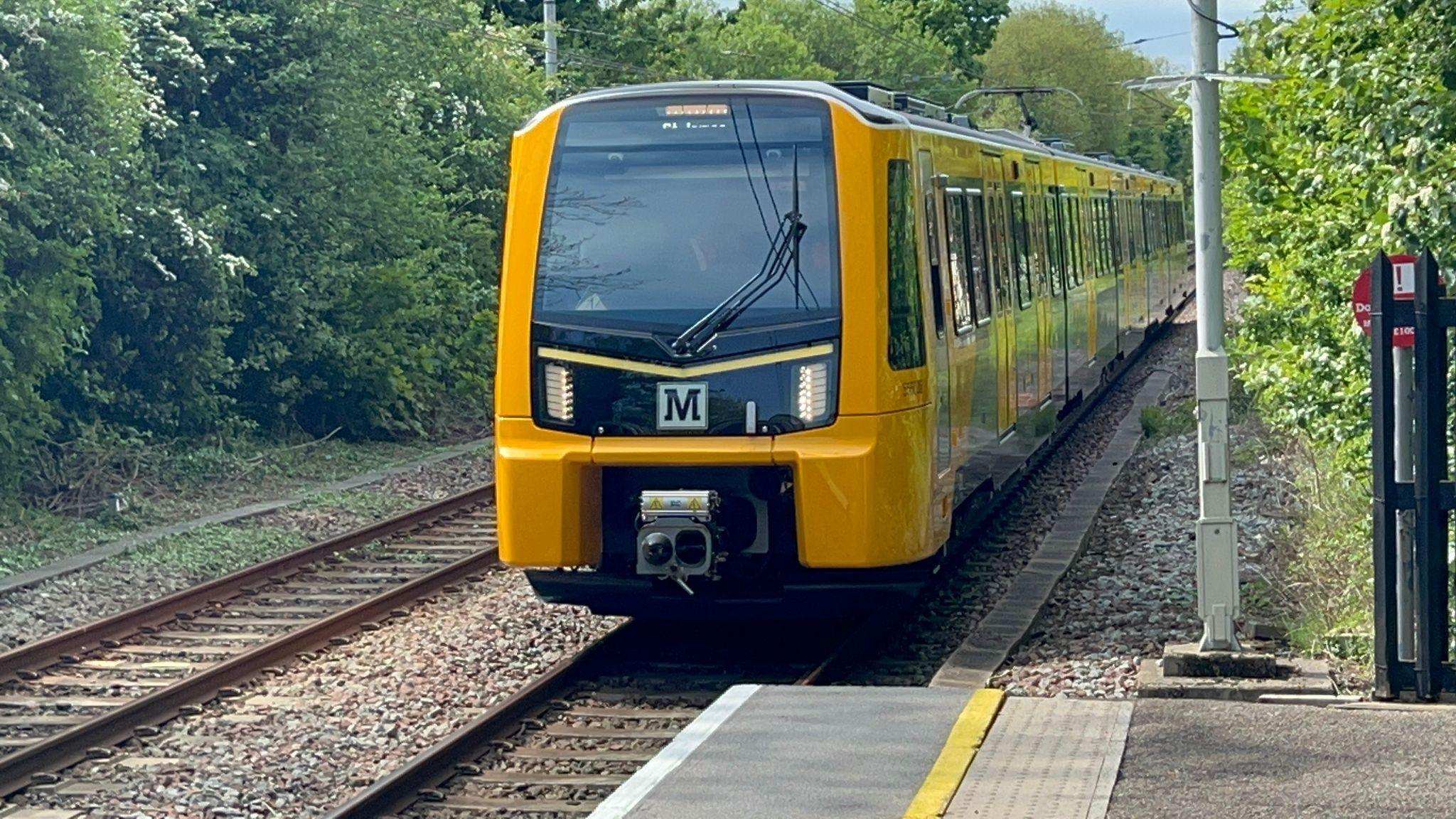 A new Metro on the tracks during daytime