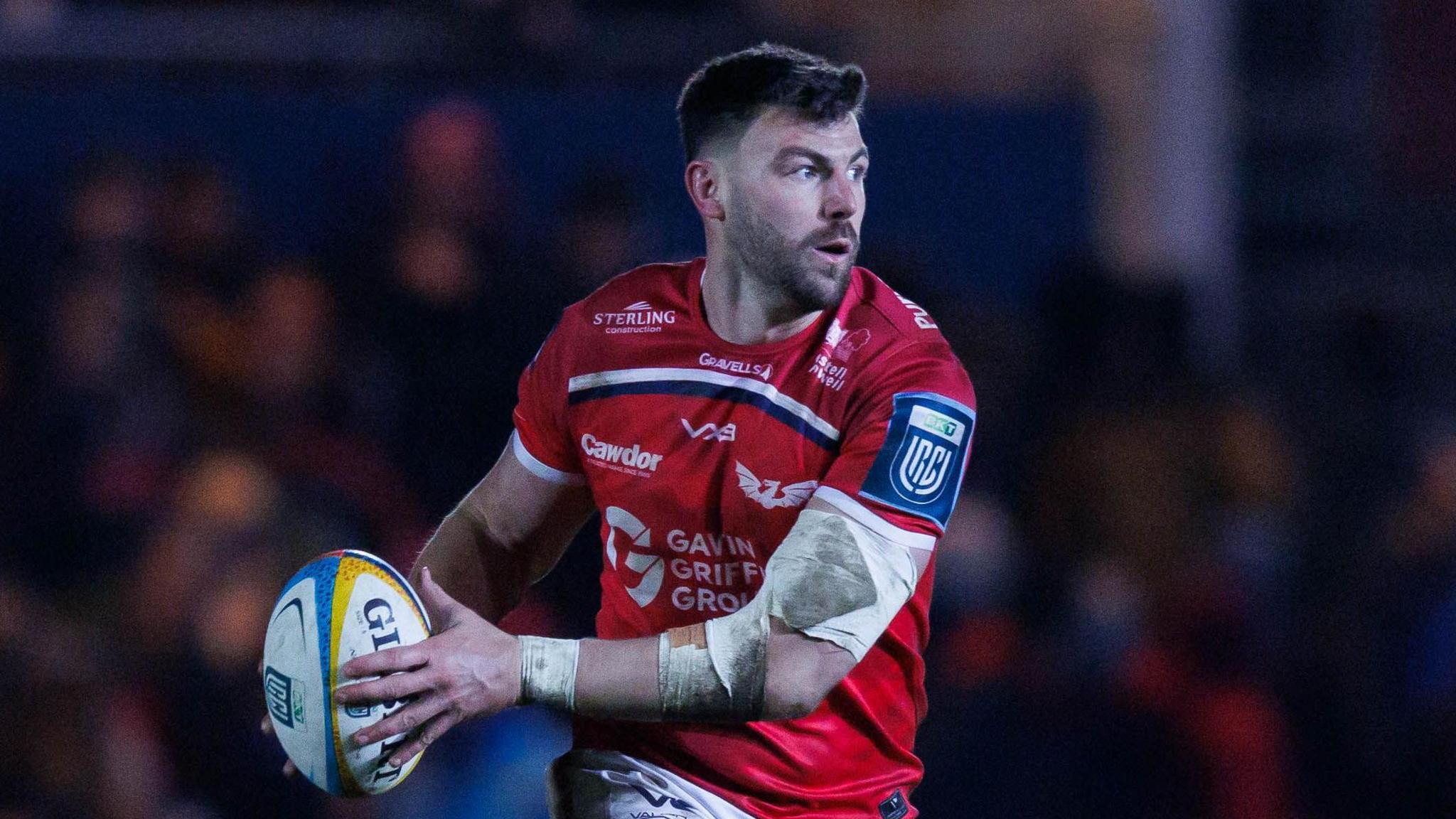 Johnny Williams carries the ball for Scarlets