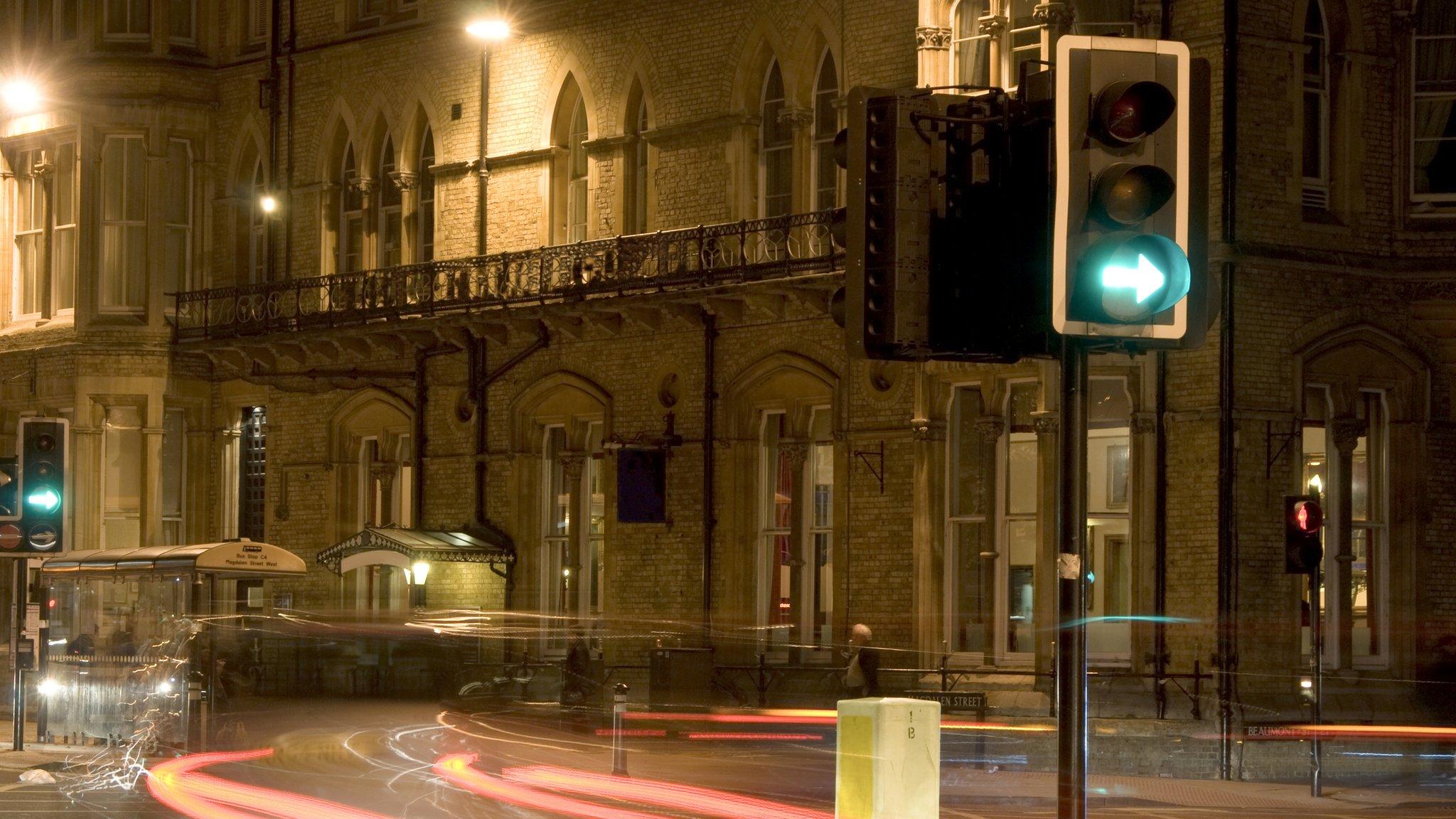 Street scene at night with traffic lights