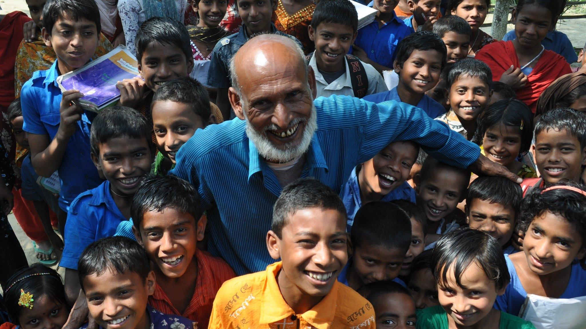 Joynal Abedin with school children