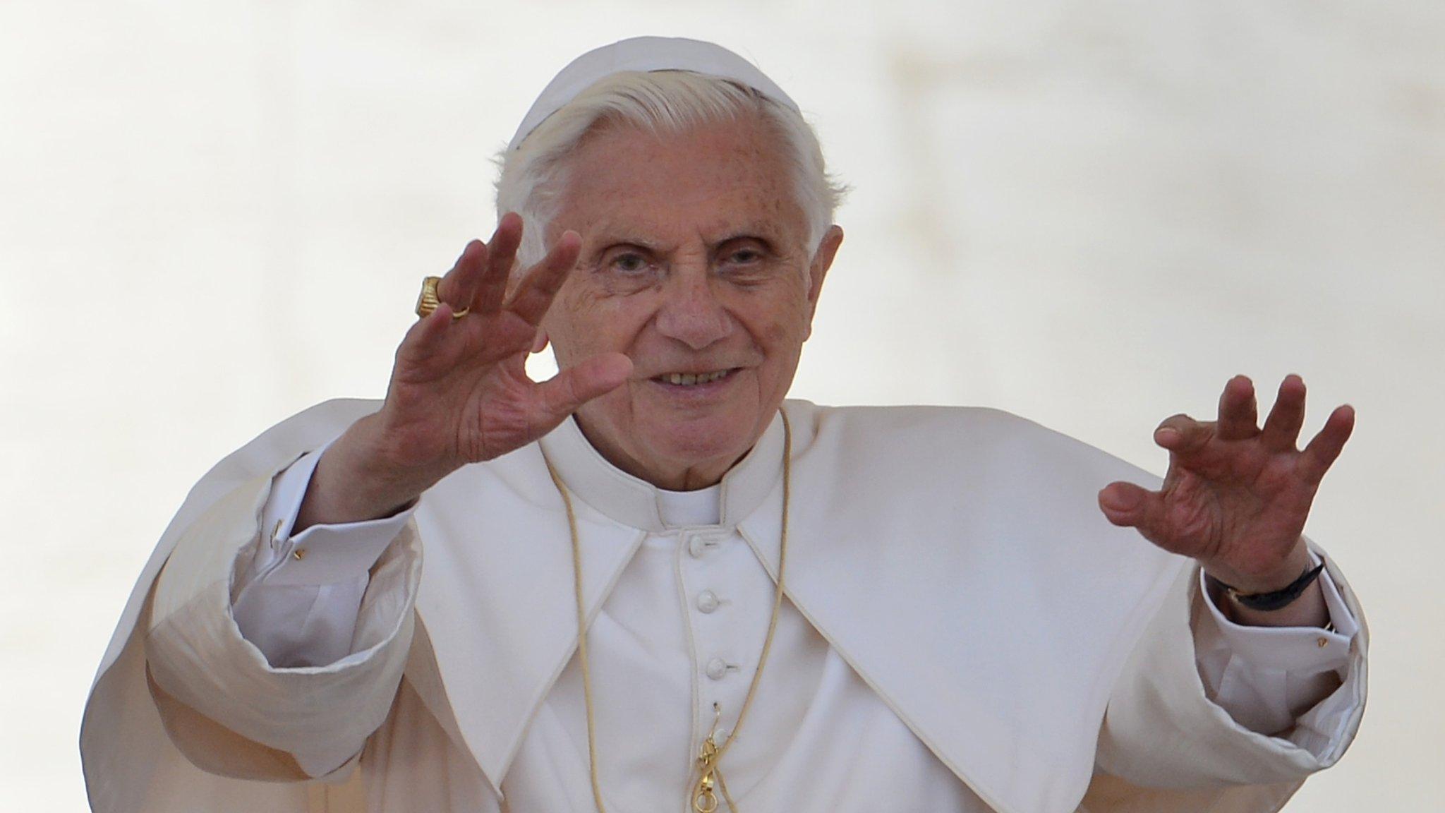 Pope Benedict XVI blesses people at a General Audience