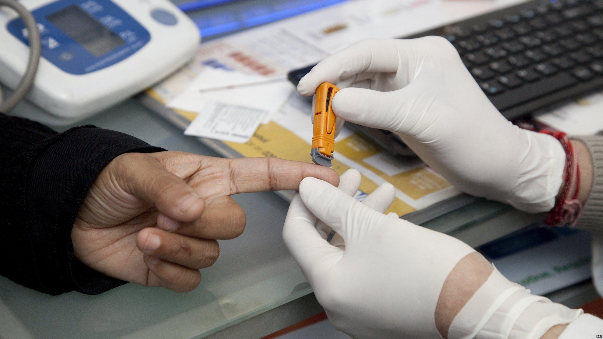 A GP taking a blood sample