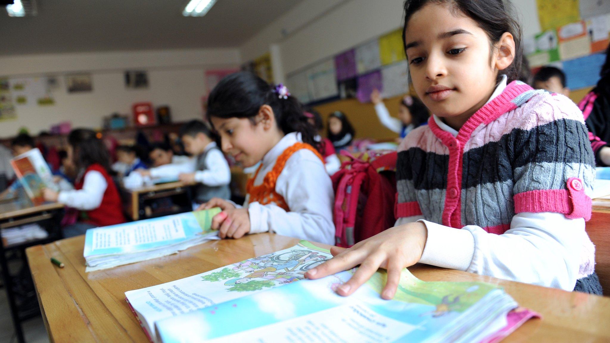 Turkish students attend a lesson at their school in Istanbul