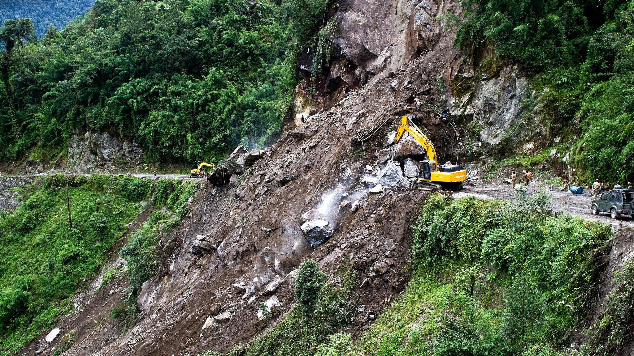 Indian personnel clear a landslip at Phengla