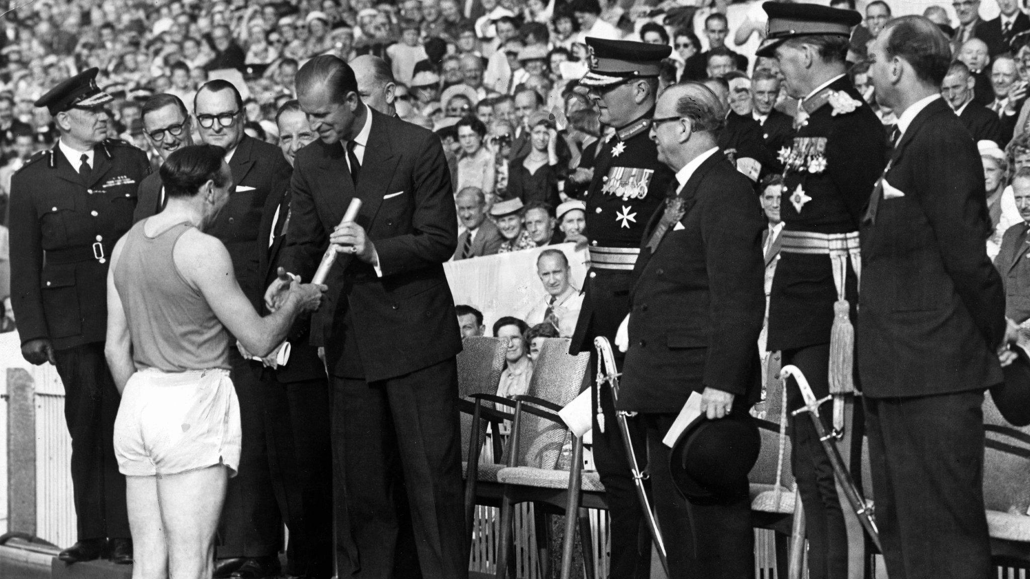 Ken Jones the baton containing the Queen's message to the Duke of Edinburgh at the opening ceremony of the British Empire and Commonwealth Games, Cardiff Arms Park, 1958. ONE USE ONLY AGREED WITH ROB NORMAN