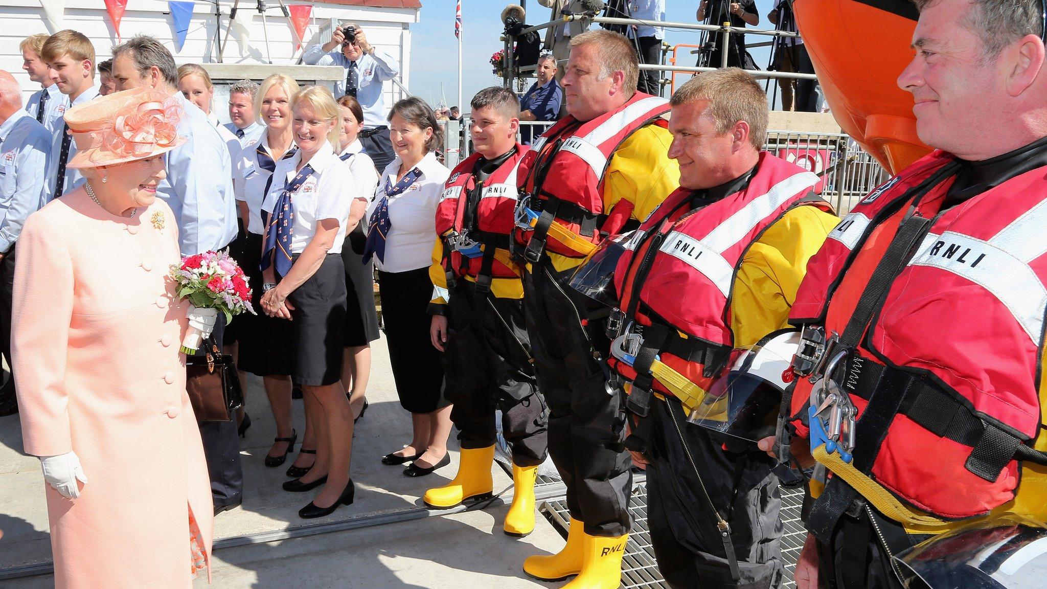 The Queen smiles as she visit Cowes Lifeboat Station during her Diamond Jubilee visit to the Isle of Wight