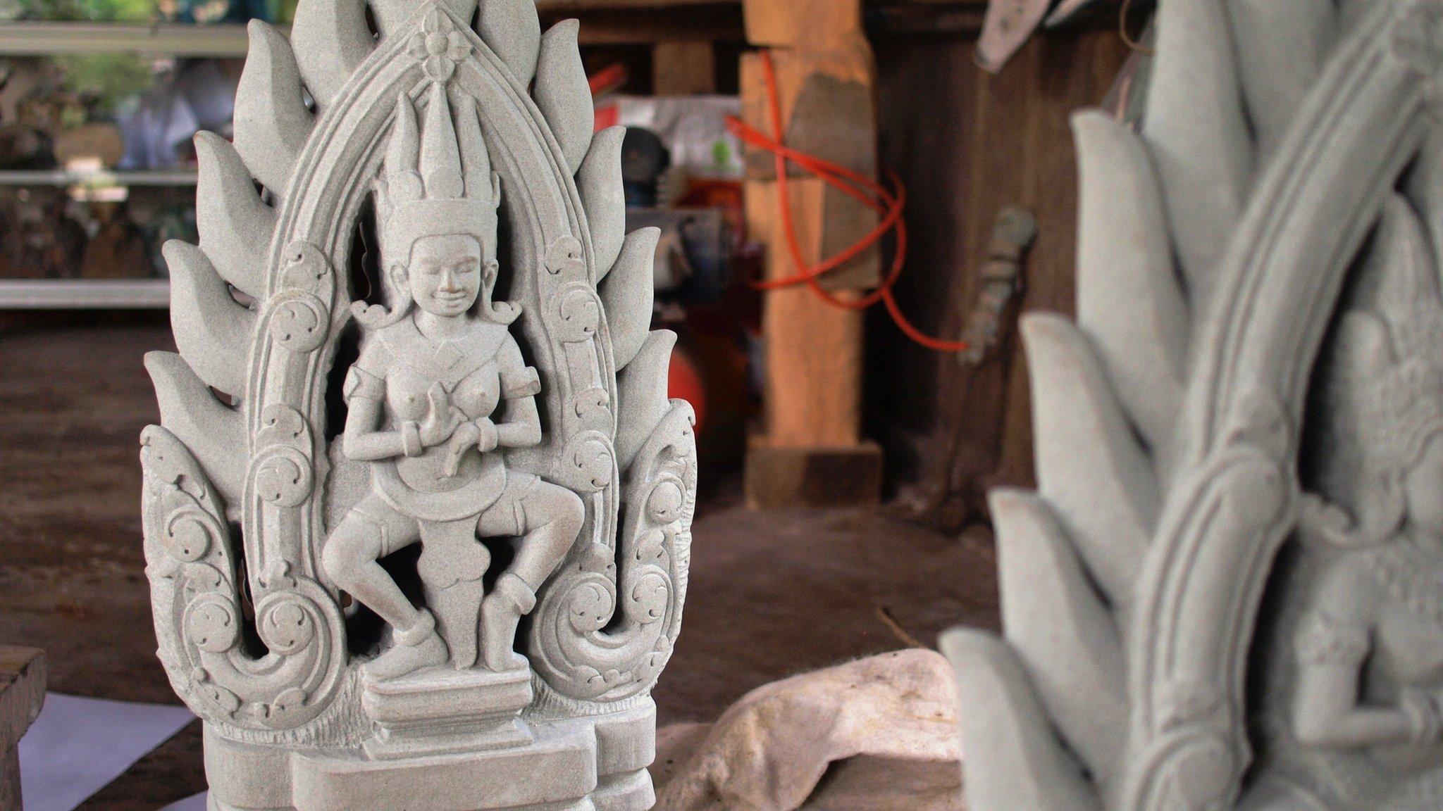 A restored sculpture at a workshop in Angkor