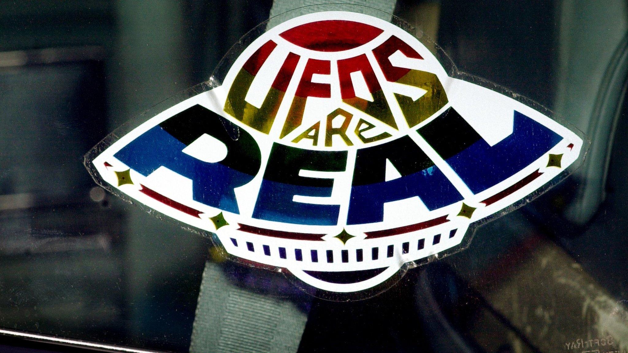 Car sticker reading "UFOs are real"