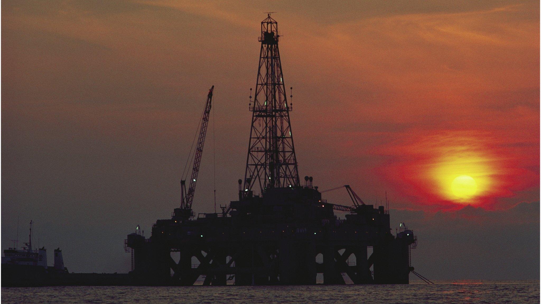 Oil platform in silhouette