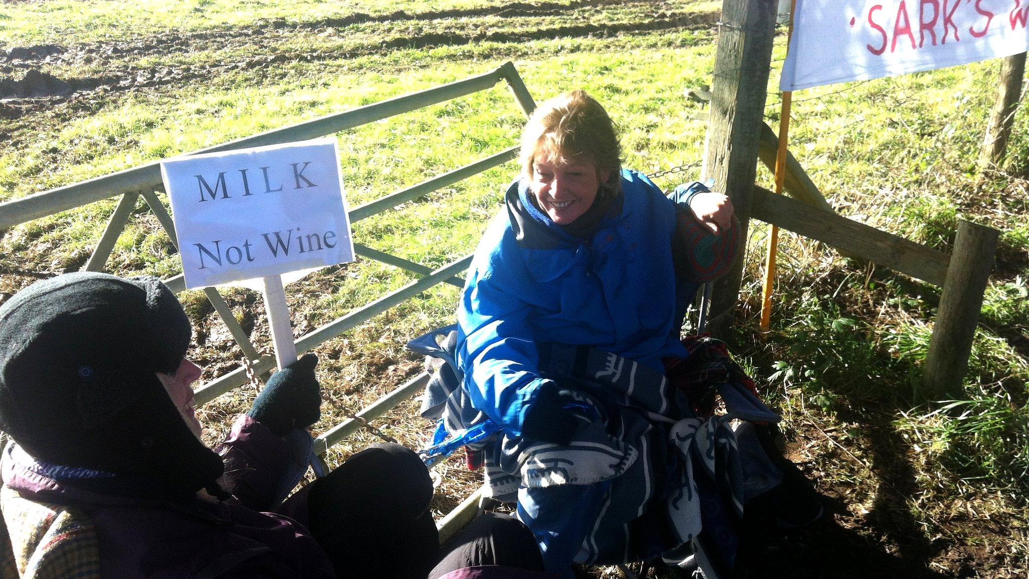 Protesters chained to a fence in Sark