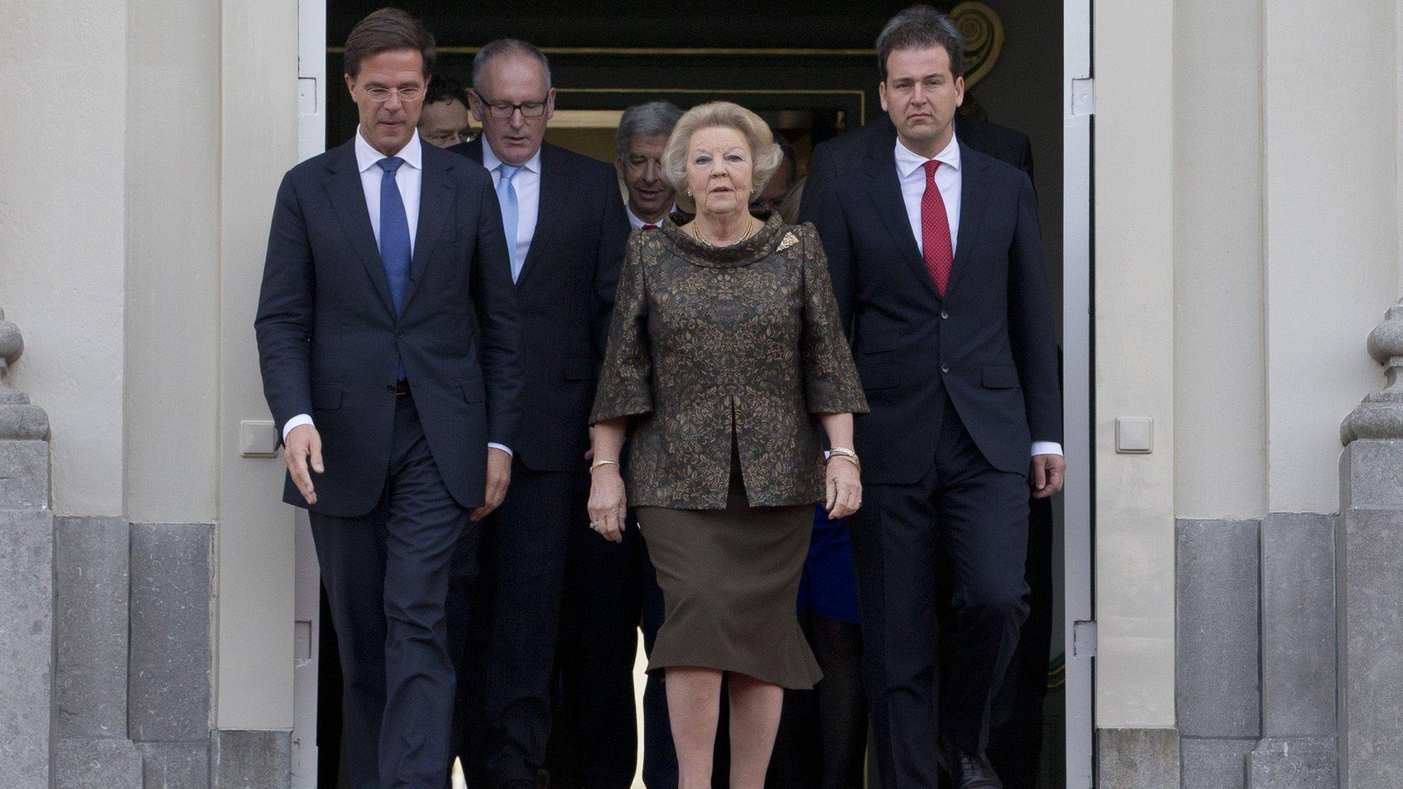 Prime Minister Mark Rutte (left) with Queen Beatrix and members of his government at the royal palace in The Hague on 5/11/12