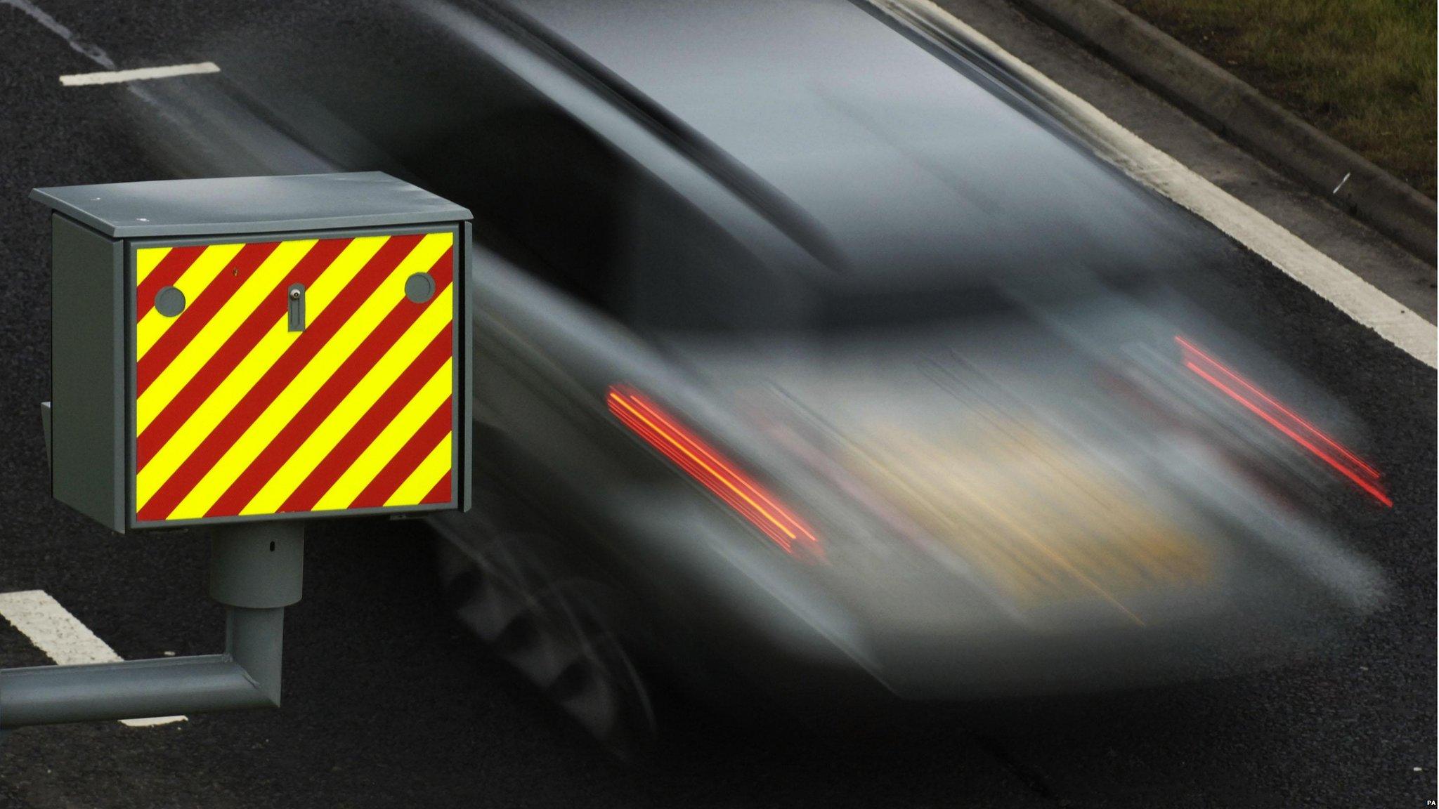 A driver passes a speed camera