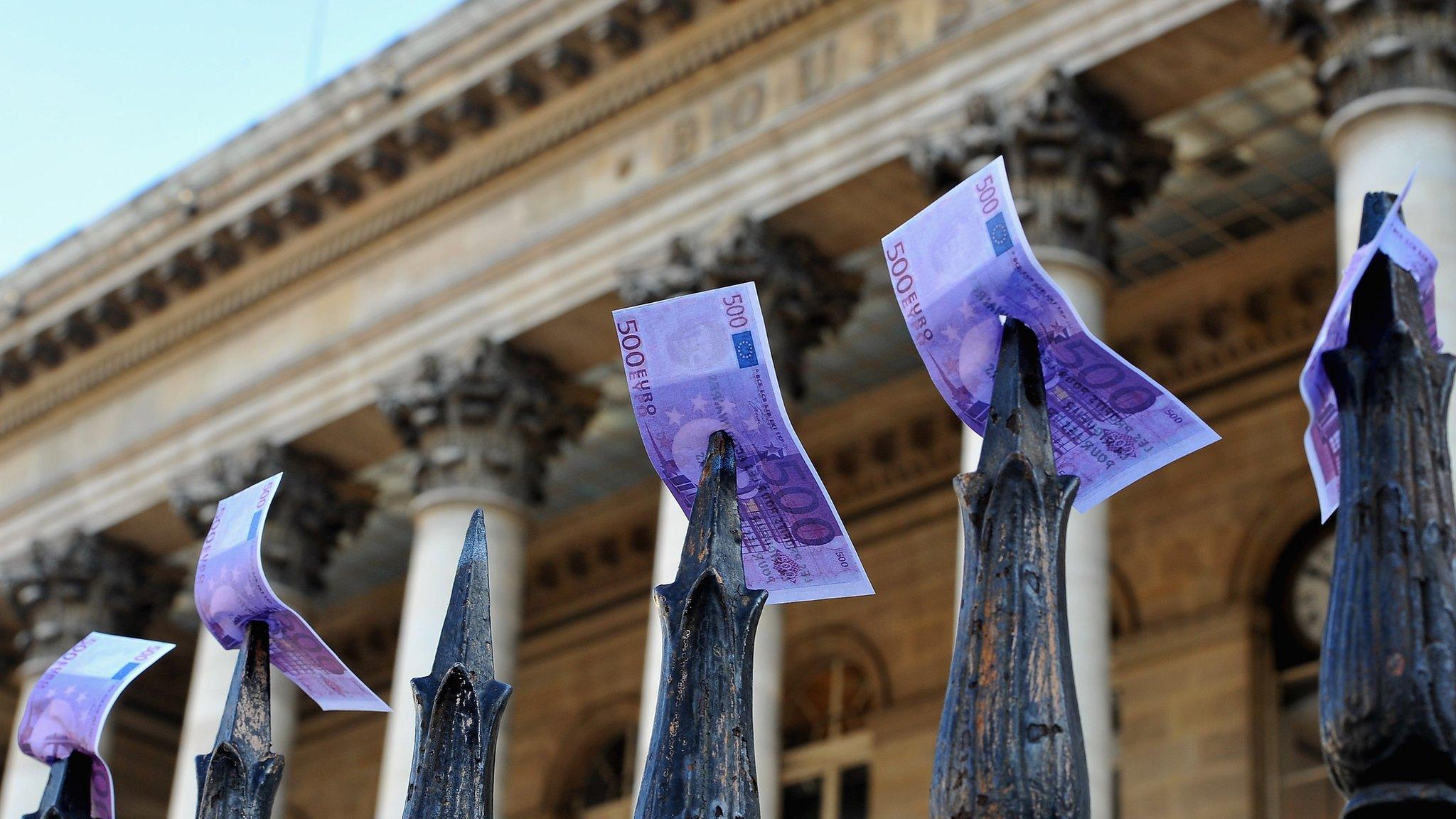 Fake euro notes placed by strikers on the gates outside the Paris Stock Exchange in November 2011