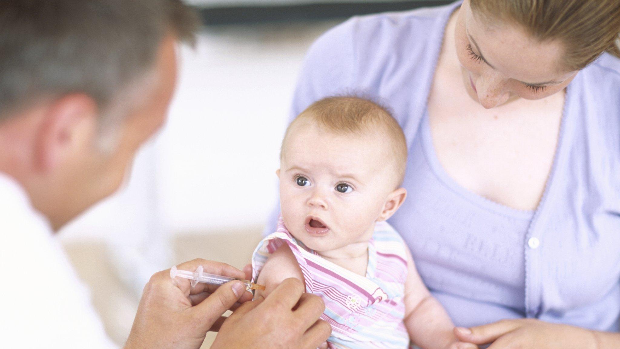 Baby being vaccinated