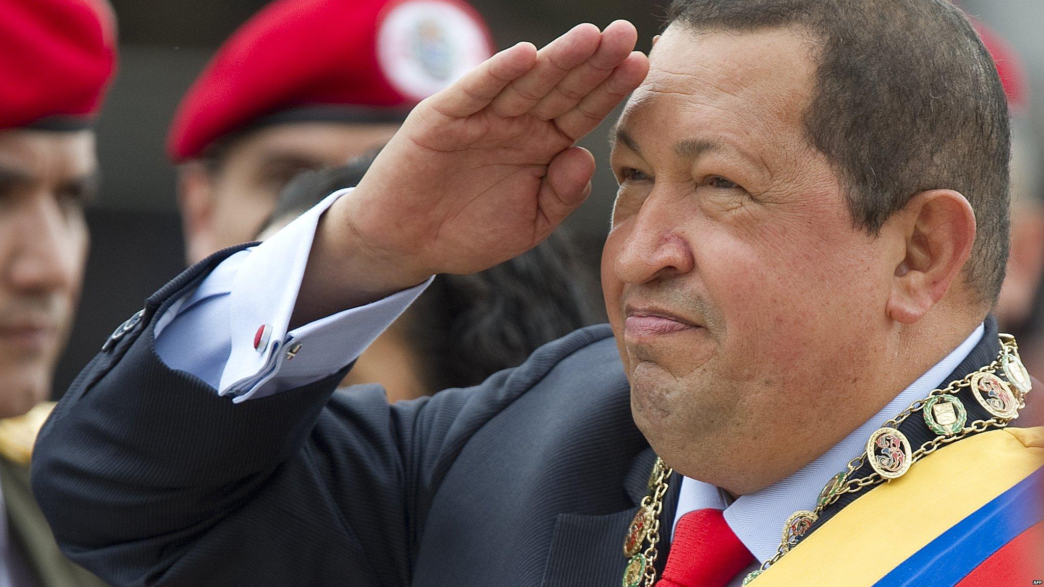 Venezuelan President Hugo Chavez salutes during a military parade to commemorate the 20th anniversary of his failed coup attempt, on 4 February 2012, in Caracas.