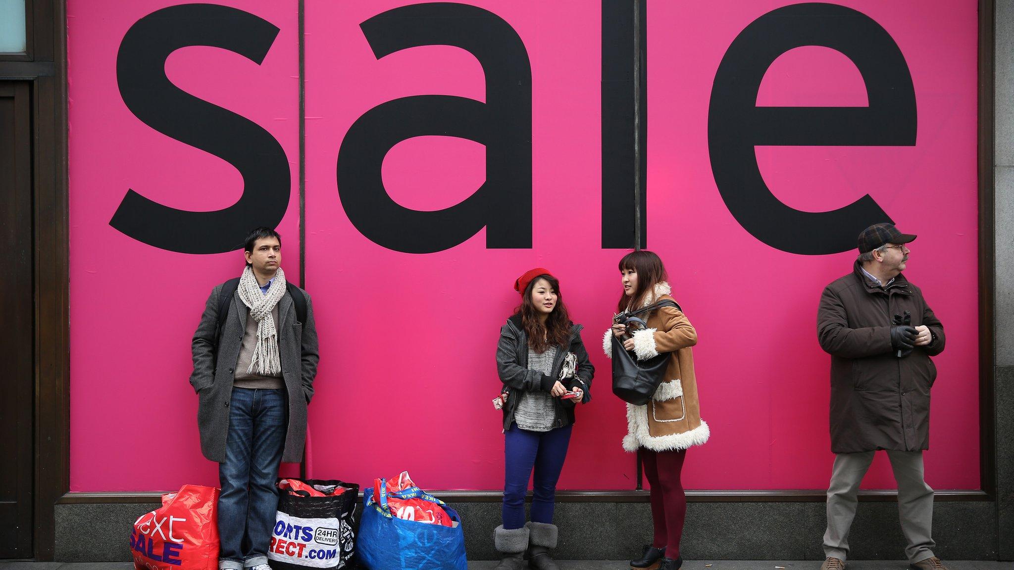 Shoppers outside a sale