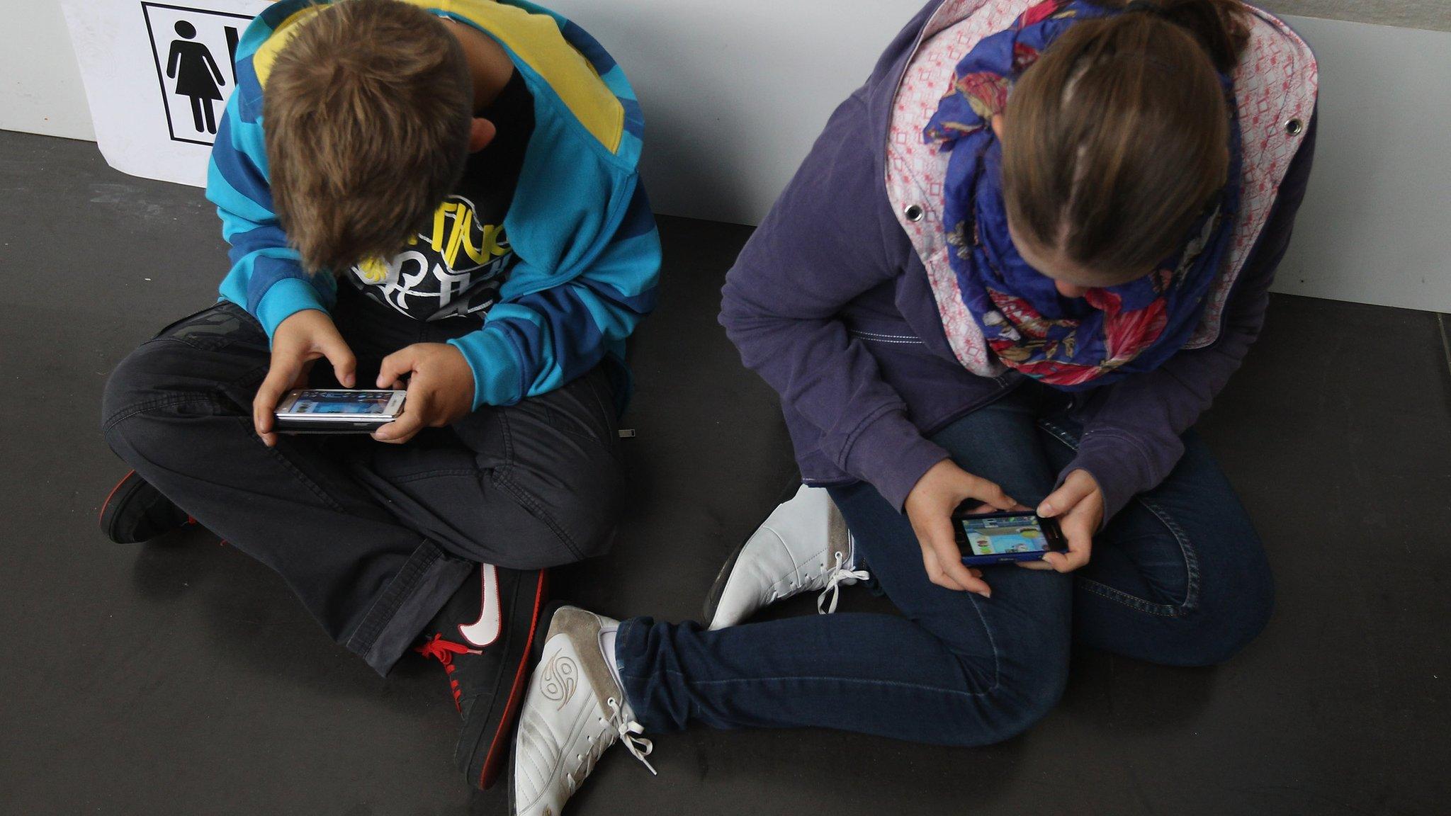 Children using mobile phones