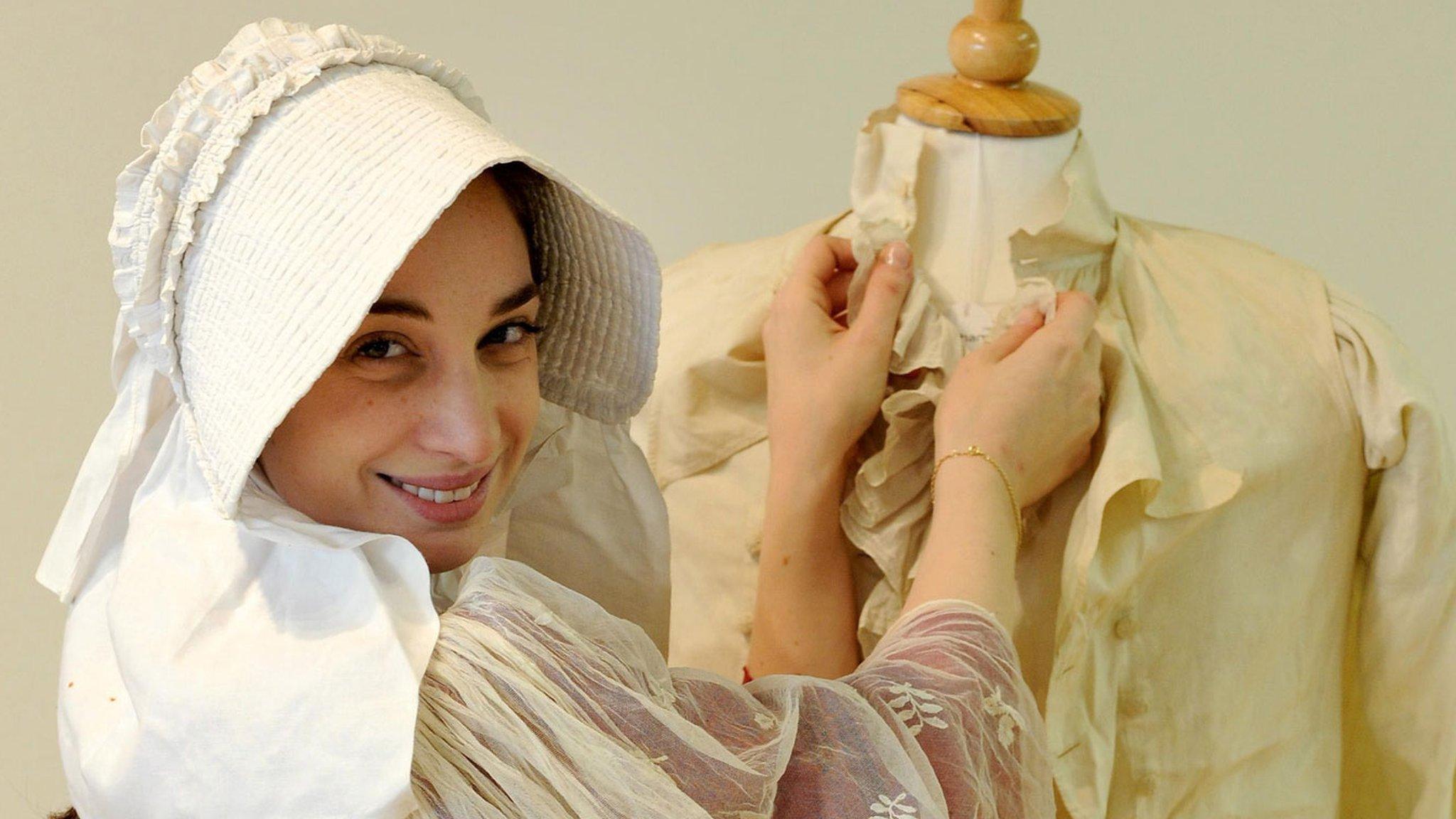 Model Joy Asfar posing with costumes similar to the outfits that would have been worn by Mr Darcy and Elizabeth, characters in Jane Austins novel Pride and Prejudice.