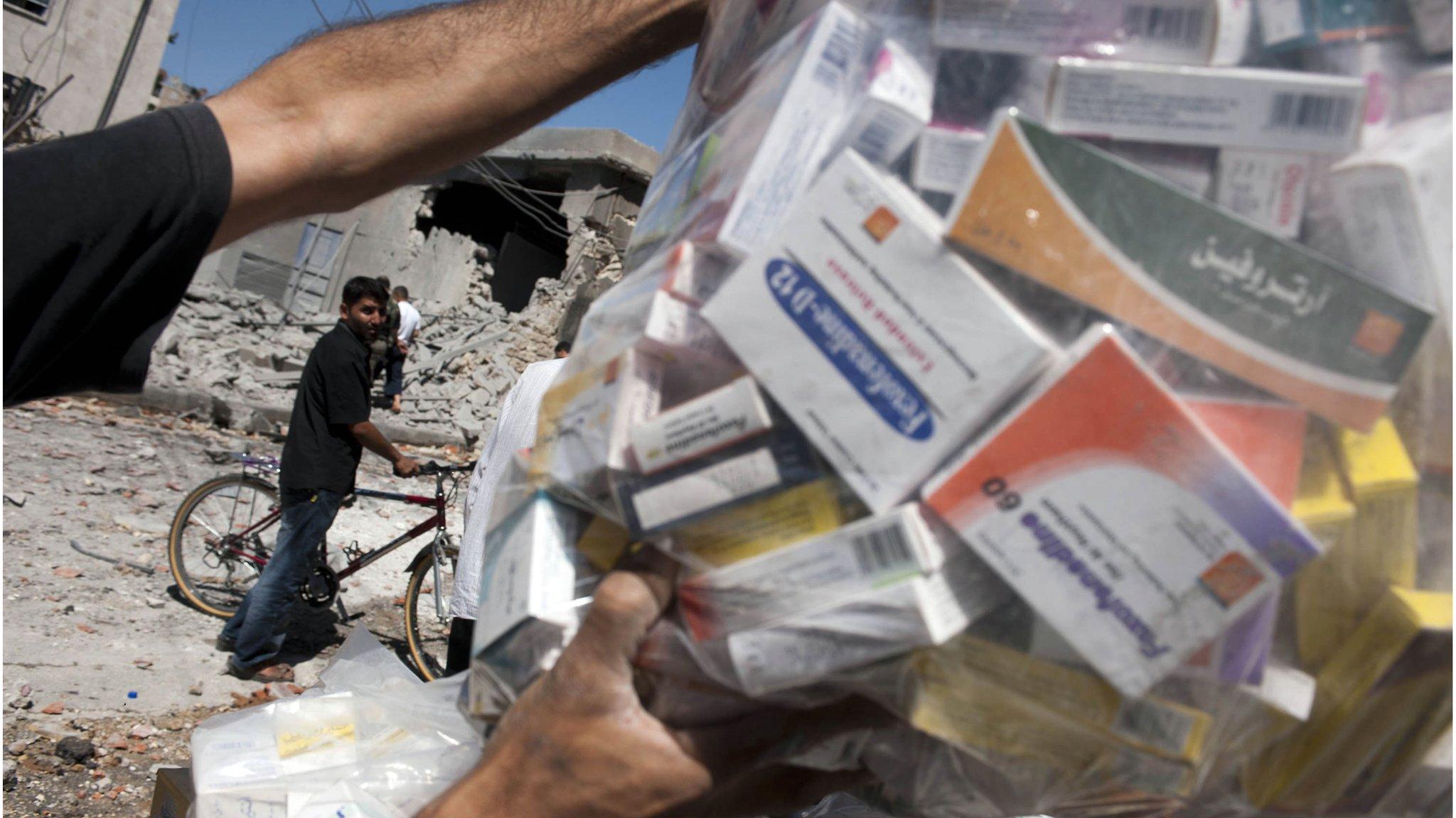 Bag of medicines salvaged from bombed pharmacy in the Bustan Pasha neighbourhood of Syria's northern city of Aleppo on 23 August 2012.