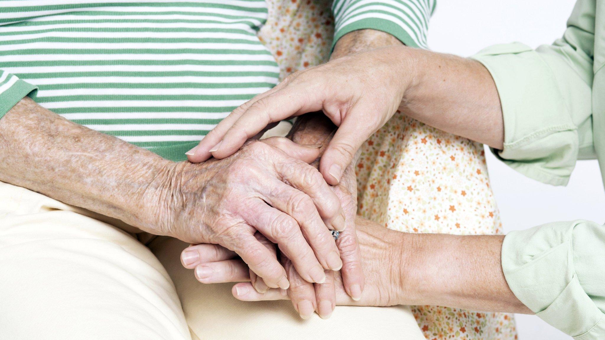 Elderly woman with her carer