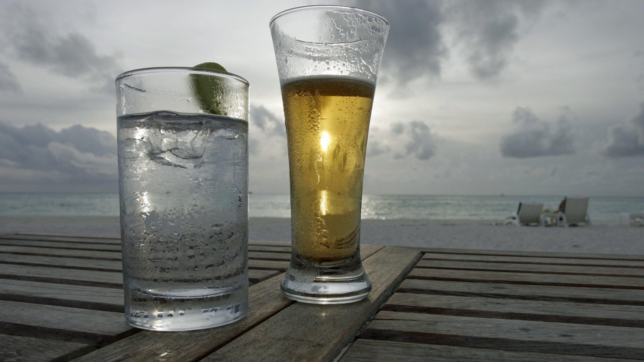 Beer and lemonade on a beachside table