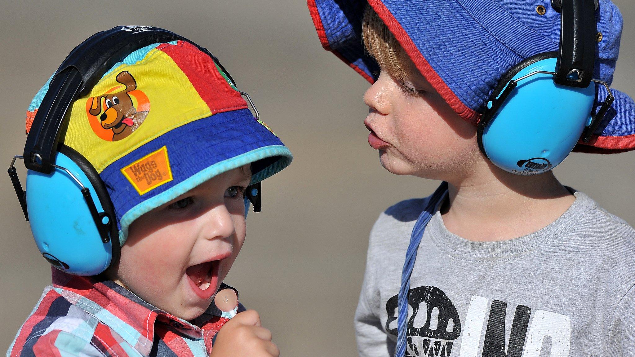 Children in noise-cancelling headphones