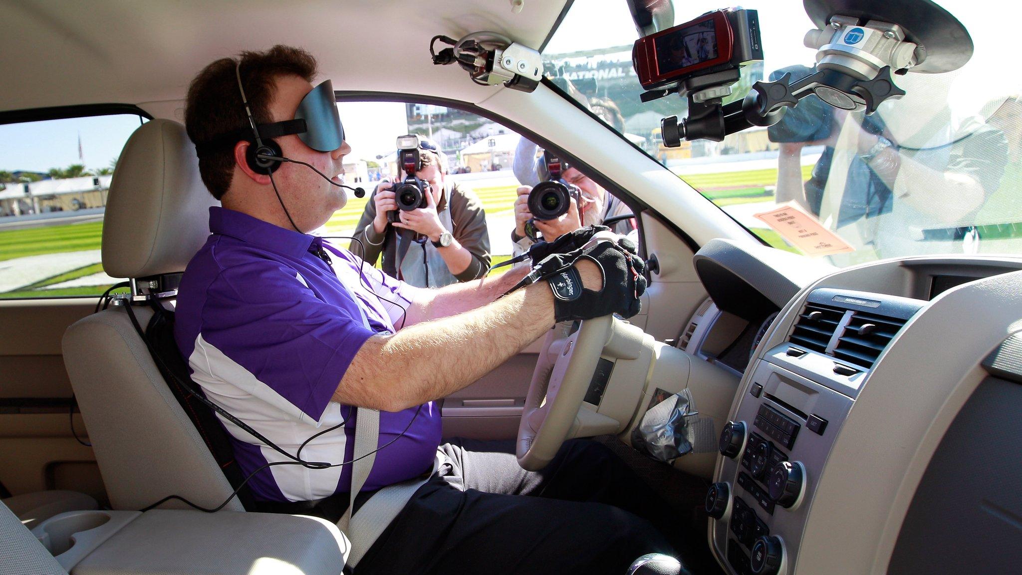 Blind driver in adapted car